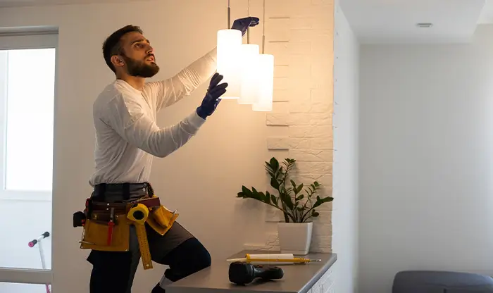 Residential Electrician installing lights